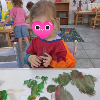 A child enjoying messy painting